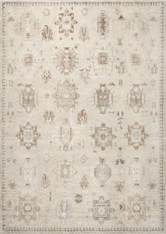 an antique rug with many different designs on the carpet and in front of it is a beige