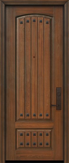 the front door is made from wood and has a metal handle