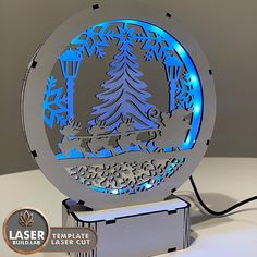 laser cut christmas ornament with blue lights