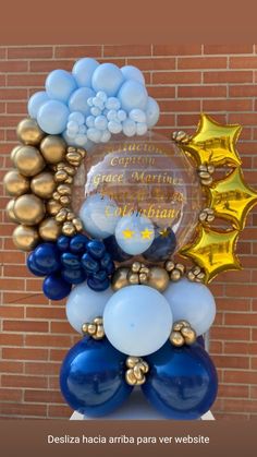 balloons are arranged in the shape of a star and moon on top of a pedestal