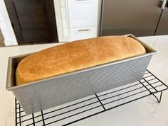 a loaf of bread sitting on top of a cooling rack