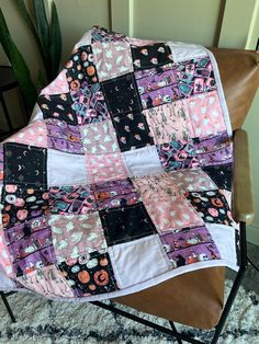 a patchwork quilt sitting on top of a chair