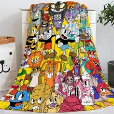 a blanket with cartoon characters all over it