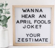 a sign that reads wanna hear an april fool joke? your zestimate is next to a potted plant