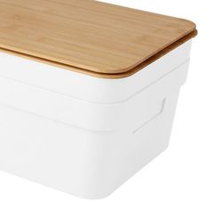 a white container with a wooden lid