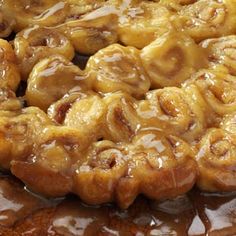 cinnamon rolls are covered in caramel sauce