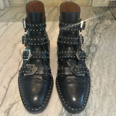 Black Studded Boot Excellent Condition Chic Black Studded Moto Boots, Chic Black Moto Boots With Studs, Designer Black Moto Boots With Buckle, Designer Black Moto Boots With Buckle Closure, Designer Black Boots With Buckle Closure, Designer Black Boots With Studs, Designer Black Studded Boots, Black Boots With Medium Fit For Fall, Black Boots For Fall With Medium Fit