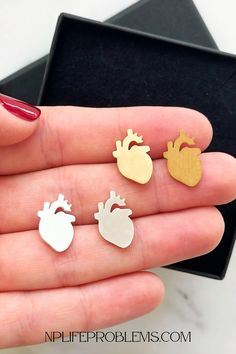 💖 Looking for the perfect gift for a cardiologist or heart health enthusiast? These cardiology heart earrings are a thoughtful and stylish way to show appreciation for their passion and profession. Whether it's for a doctor, nurse, or medical student, these heart-shaped earrings are a subtle yet meaningful accessory. 💎❤️ #CardiologyGifts #HeartEarrings #DoctorGiftIdeas #NurseGifts #MedicalJewelry #GiftForHer #HeartHealth #CardiologistGift #UniqueEarrings #MedicalThemedGifts Doctor Gift Ideas, Working In Healthcare, Medical Pins, Doctor Graduation Gift, Heart Surgeon, New Grad Nurse, Medical Fashion, Doctor Graduation