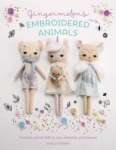 three stuffed animals are standing next to each other in front of a sign that says, gingermen's embroideded animals