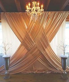 an image of a stage set up with chandelier and drapes on it