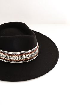 Head out into the sun knowing you look rodeo-ready in the Out West Vibe Black Wide Brim Fedora Hat! This trendy hat has a wide brim, ultra soft and structured felt-like material with a fedora design and a knit band. The luxe design can be paired with maxi dresses and block heels or dressed casual with flare jeans and a graphic tee! Soft Felt Material Wide Brim Structured Fit Fedora Style Knit Band One Size | Brim Diameter Approx. 15" | Head Diameter Approx. 8” | Crown Approx. 7" | Brim Length 3. Beach Black Fedora With Curved Brim, Black Artisan Fedora With Flat Brim, Black Fedora With Flat Brim For Western-themed Events, Black Brimmed Western Felt Hat, Black Artisan Brimmed Fedora, Fedora Style, Fedora Hat Women, Luxe Design, Wide Brim Fedora