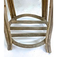 an old wooden stool with curved legs on a white background, the seat is made out of wood