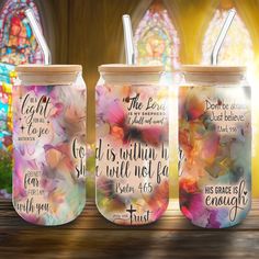 three mason jars with bible verses painted on them