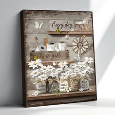 a wooden sign with daisies and other items on it that says every day is a gift