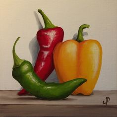 three peppers are sitting on a shelf in front of a white wall, one is orange and the other is green