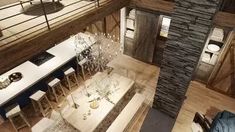 an aerial view of a dining room and living room in a house with stone walls