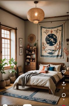 a bed room with a neatly made bed and a tapestry on the wall above it