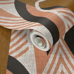 an orange and black abstract design on fabric