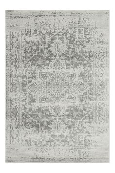 a gray and white rug with an intricate design on the bottom, in front of a white background