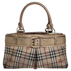 Adorned with the classic Burberry Haymarket check canvas, this Burberry Bridle tote is accented with metallic gold leather. It is detailed with a huge gold-tone buckled belt on the front and rolled leather top handles. The open top leads to a fabric-lined interior with a zip pocket. Hat Jewelry, Jeans For Girls, Shoes For Summer, Check Coat, Church Hats, Bows Hair, Women's Heels, Jeans For Women, Coin Purses