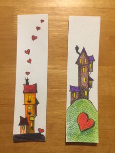 two handmade bookmarks with houses and hearts on them, one has a red heart