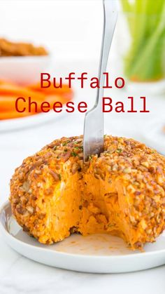 a cheese ball with a knife stuck in it