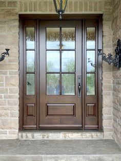 the front door to a home with two sidelights