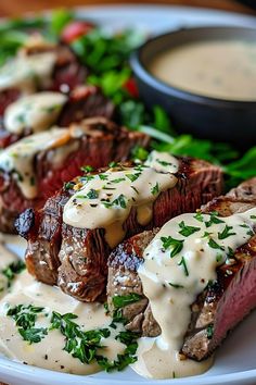 Steak with Garlic Cream Sauce is a rich  Ingredients:  2 ribeye or sirloin steaks (about 1-inch thick) Salt and black pepper, to taste 1 tbsp olive oil 2 tbsp butter  Garlic Cream Sauce: 4 cloves garlic, minced 1 cup heavy cream 1/4 cup beef broth 1/4 cup grated Parmesan cheese 1/2 tsp Italian seasoning Fresh parsley, for garnish  Instructions:  Season steaks with salt and pepper. Heat olive oil in a skillet over medium-high heat. Sear steaks for 3-4 minutes per side for medium-rare, adjusting for desired doneness. Remove steaks from skillet and set aside.    Prep Time: 5 mins | Cook Time: 10 mins | Total Time: 15 mins | Kcal: 650 | Servings: 2 Garlic Cream Sauce, Seared Steak, Medium Rare, Sirloin Steaks, Food Goals, Cream Sauce, Beef Broth, Parmesan Cheese