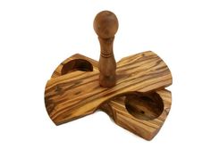 two pieces of wood are sitting on top of each other, one is shaped like an umbrella and the other has a wooden handle