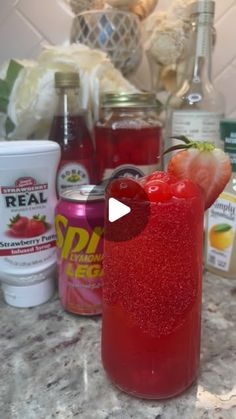 a red drink sitting on top of a counter