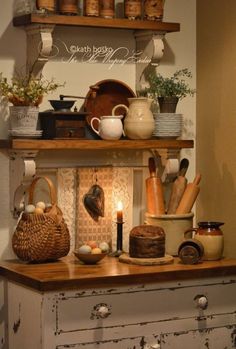 an old dresser with some pots and pans on it