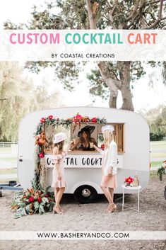 two women standing in front of a food truck with the words custom cocktail cart written on it