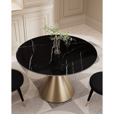 a black and gold dining table with flowers on it in the middle of a room