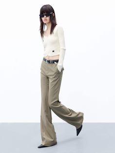 MO&Co. Women's High Waist Tailored Pants Feel confident and stylish with these tailored pants. Crafted from pure wool, with a straight-leg cut and a flattering drape, these pants feature a zip, hook and button closure as well as side pockets. Elevate your look with the perfect blend of sophistication and chic – pair them with a shorter top for a truly unique and fashionable ensemble. Features : - Straight cut with slightly wide hems- Zipper, hook and button closure- Double side pocket design Cod Tailored Wide-leg Dress Pants For Fall, Chic Wool Bottoms For Fall, Chic Wool Straight Pants, Chic Straight Wool Pants, Chic Wool Pants, Modern Tailored Pants For Fall, Tailored Straight Dress Pants For Fall, Fitted Wide Leg Pants With Belt Loops For Fall, Chic Wool Dress Pants With Belt Loops