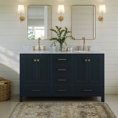 a bathroom with two sinks, mirrors and a rug in front of the sink area