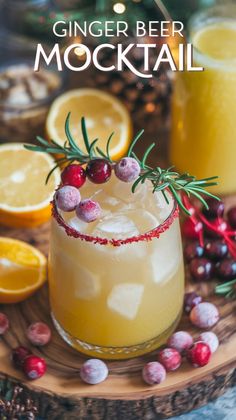 ginger beer mocko cocktail with cranberries and rosemary garnish on the rim