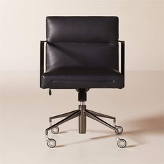 a black leather office chair with wheels on it