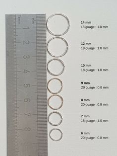 a ruler and some metal rings on a table