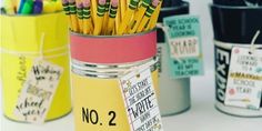 there are many pencils in the cup on the table next to each other and one is labeled no 2