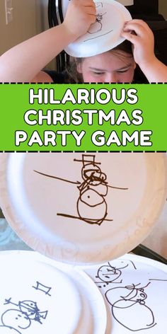 a child holding up a paper plate with drawings on it and the words hilarrous christmas party game