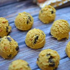 several balls of food sitting on top of a wooden table