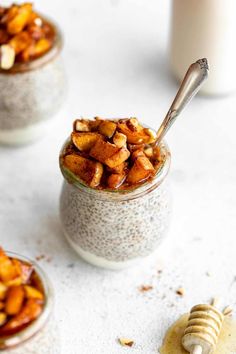 three small jars filled with chia pudding next to a jar of honeycombs