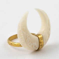 Our Golden horn ring from our Matahari Collection is hand carved bone with a unique and intricate Balinese design on the front and back... Set in silver plated in 22k gold. An elegant statement piece. different sizes available please inquire upon ordering... Carved Bone Ring, Unique Carved Bone Jewelry, Unique Bone-colored Carved Jewelry, Dragons Hoard, Bone Rings, Bones Jewelry, Bone Jewellery, Balinese Design, Western Goth