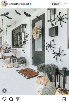 a porch decorated for halloween with spider decorations