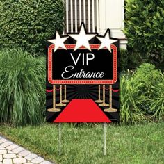 a red carpet and black sign with stars on it that says, vrp entrance