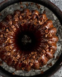 a bundt cake with chocolate frosting and sprinkles