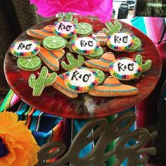 decorated cookies on a plate with the word kco