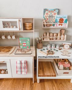 a wooden play kitchen with lots of toys