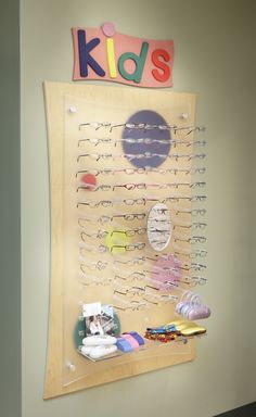 an eyeglass display with kids's sunglasses on it