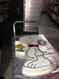 a cake that is shaped like a snoopy dog